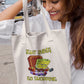 smiling woman holding a canvas tote bag with a picture of spongebob getting off the sofa saying right I'mma go shopping, relatable memes