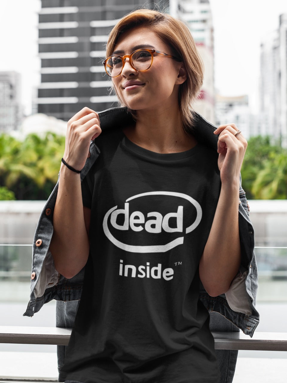 Check out our picture of a girl wearing our black "Dead Inside" t-shirt, inspired by the Intel Inside logo. Made with high-quality materials, this edgy shirt is perfect for making a statement with your fashion choices. Order yours today and turn heads wherever you go! relatable, sarcastic memes