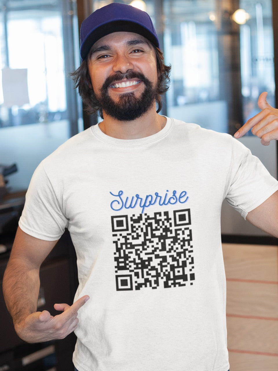 Man wearing a blue cap and a white tshirt with QR code with surprise written on it