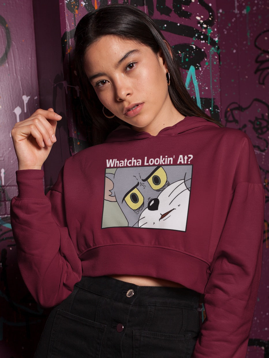 girl wearing a maroon crop hoodie with picture of tom in suspicious judging look asking Whatcha lookin' at? printed on it, sarcastic funny memes