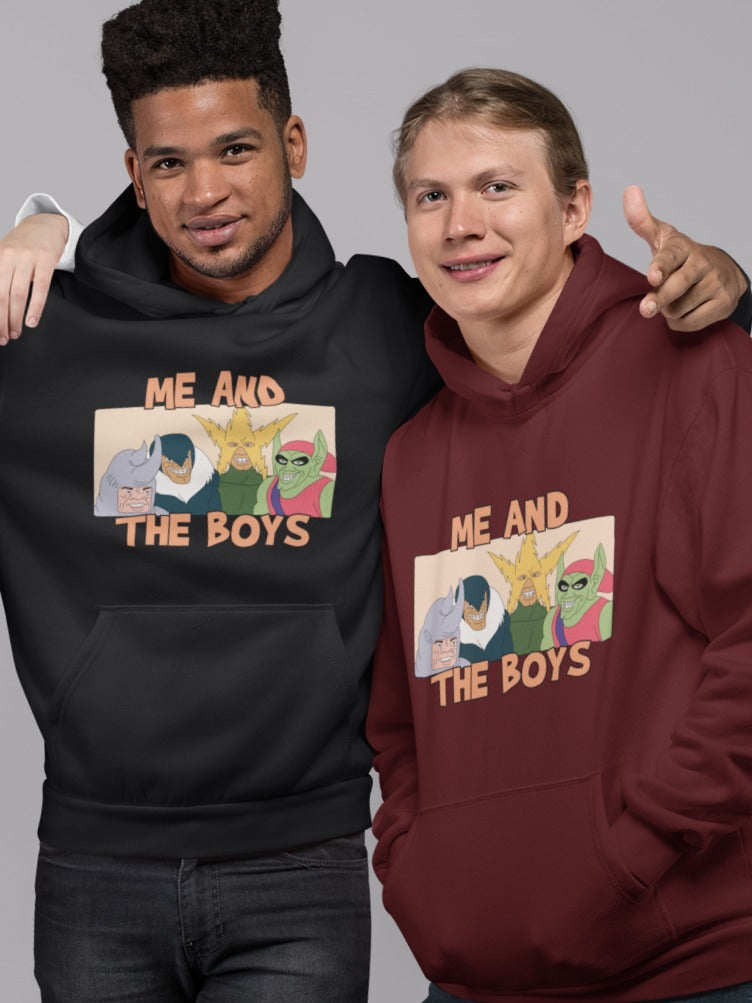 brown man wearing black hoodie with me and the boys Spiderman meme printed on it, his left hand is on the left shoulder of his friend wearing maroon hoodie with me and the boys Spiderman villains meme printed on it, fam 