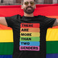 person wearing goggles and holding a rainbow flag is wearing a black tee with there are more than two genders written on it in rainbow palette