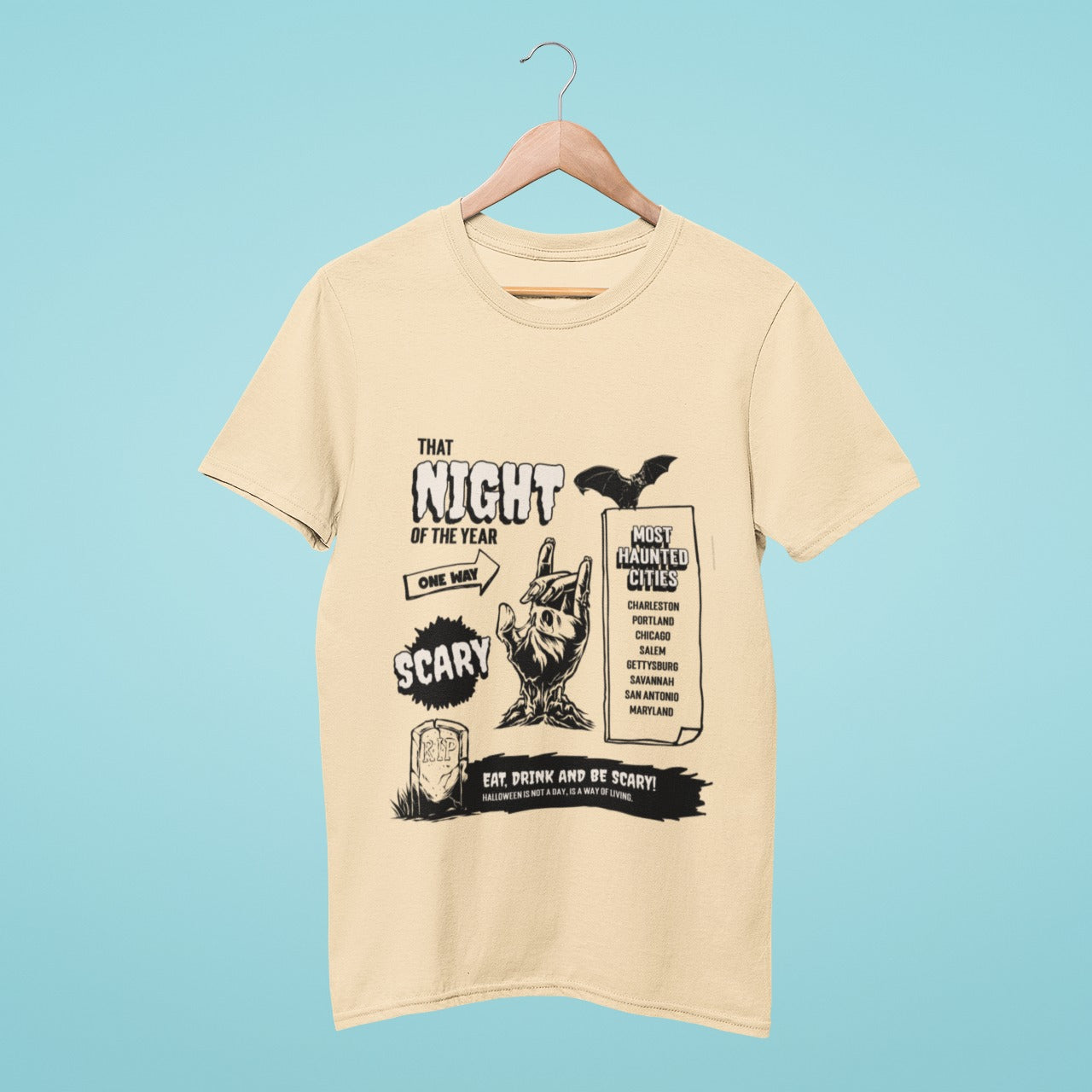 Unleash your spooky side with this beige t-shirt, featuring a chilling list of scary cities, a tombstone that reads "Eat, Drink and be Scary, Halloween is not a Day, it's a way of living," and a zombie hand. Perfect for Halloween or any horror-themed occasion. Get ready to scare and be scared in style.