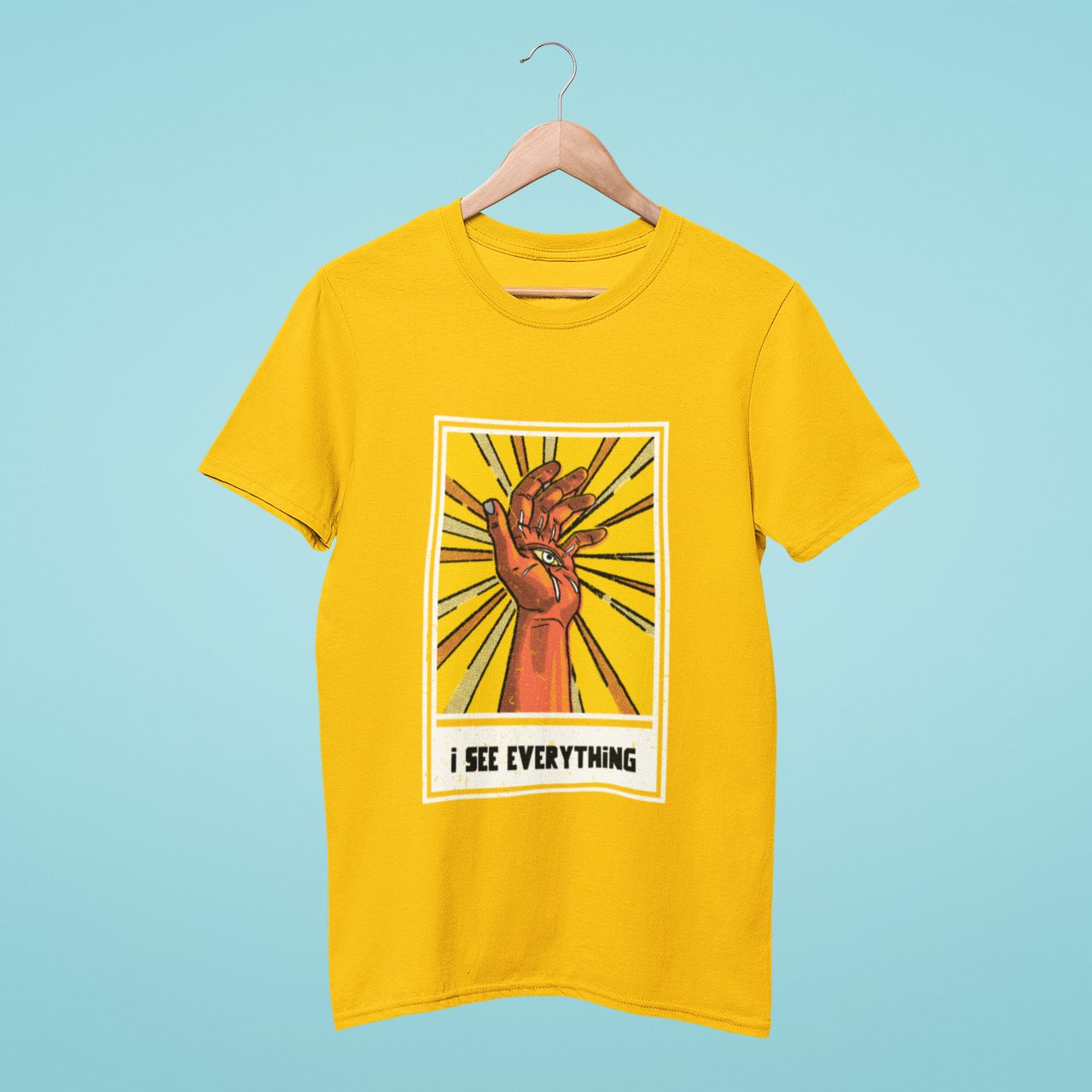 See everything with this bold yellow t-shirt featuring an eye and hand graphic. The 'I see everything' slogan is sure to turn heads and make a statement. Perfect for those who like to keep their eye on the prize.