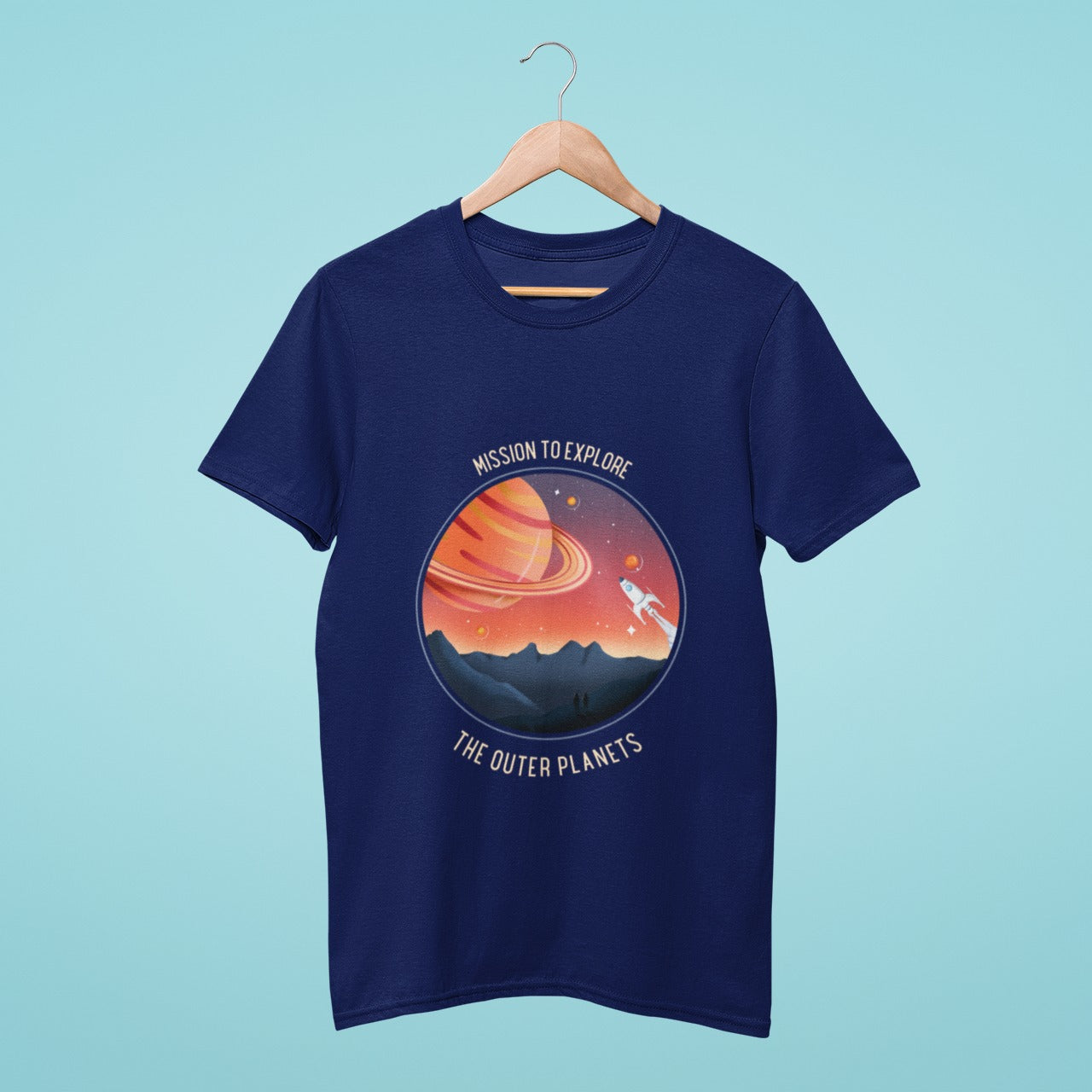 Get ready for an interstellar journey with this navy blue t-shirt featuring a rocket and planets. The slogan "Mission to Explore the Outer Planets" boldly proclaims your love for space exploration. Wear it to show your passion for the cosmos and inspire others to dream big.