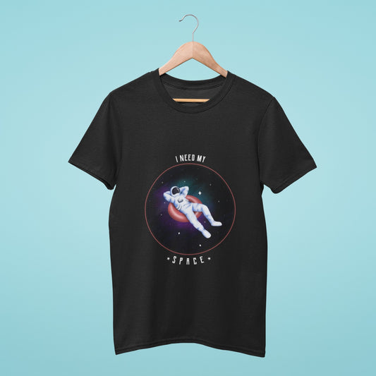 This black t-shirt features an astronaut relaxing on a doughnut in space with the slogan "I Need My Space." Perfect for space enthusiasts and those who love to relax. Get ready to take off with this stylish and comfortable tee!