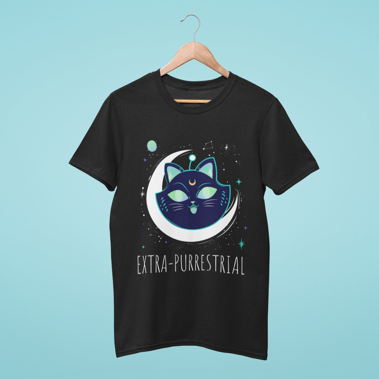 Elevate your wardrobe with our black t-shirt featuring a one-of-a-kind design of an alien-like cat's face on a crescent moon, with the title "Extrapurrestrial". Perfect for cat enthusiasts and those who love unique fashion. Made from high-quality materials, this comfortable and durable t-shirt is a must-have. Order now and show off your love for feline creatures and the extraterrestrial!