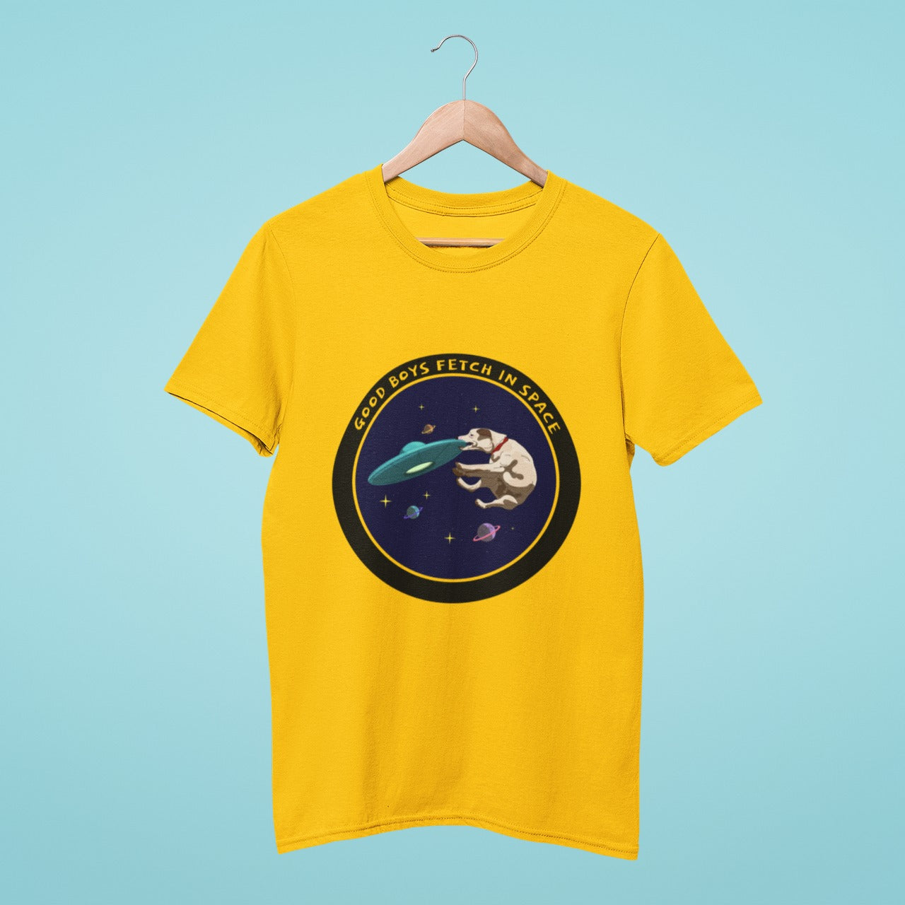 Add some playful charm to your wardrobe with our yellow t-shirt featuring a delightful design of a dog playing with a UFO in space, with the slogan "Good Boys Fetch in Space". Perfect for dog lovers who also love fun, lighthearted fashion. Made from high-quality materials, this comfortable and durable t-shirt is a must-have. Order now and show off your love for furry friends and the cosmos!