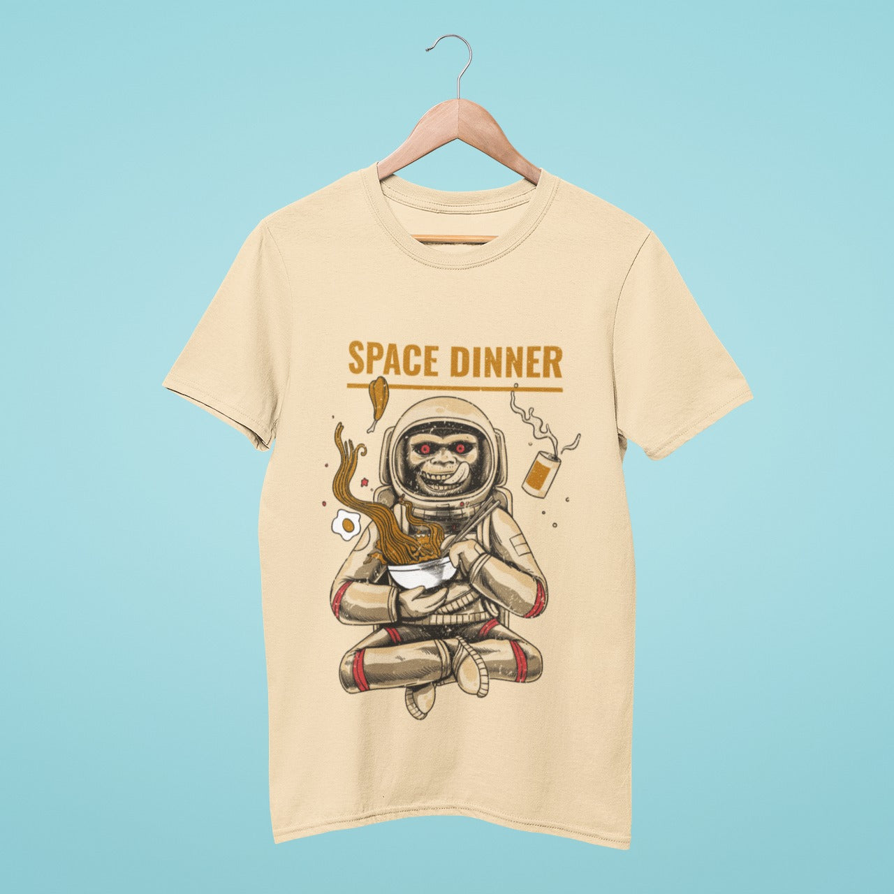 Elevate your wardrobe with our beige t-shirt featuring a playful monkey in a spacesuit enjoying dinner in space. The "Space Dinner" slogan adds a unique touch to this lighthearted design. Perfect for casual outings or as a gift for space enthusiasts. Add some humor to your wardrobe and order now!