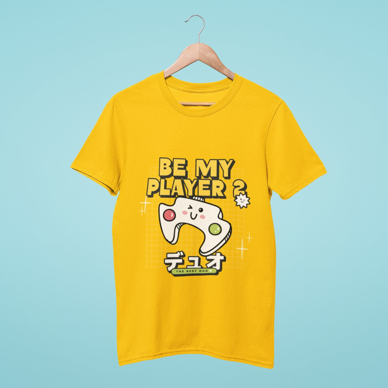 This yellow t-shirt is the perfect way to find your Player 2! With a cute winking joystick and the Japanese word for duo, it's clear that you're looking for a gaming partner. The slogan "Be my Player 2" adds a playful touch, and the small text "The Best Duo" reinforces the message.