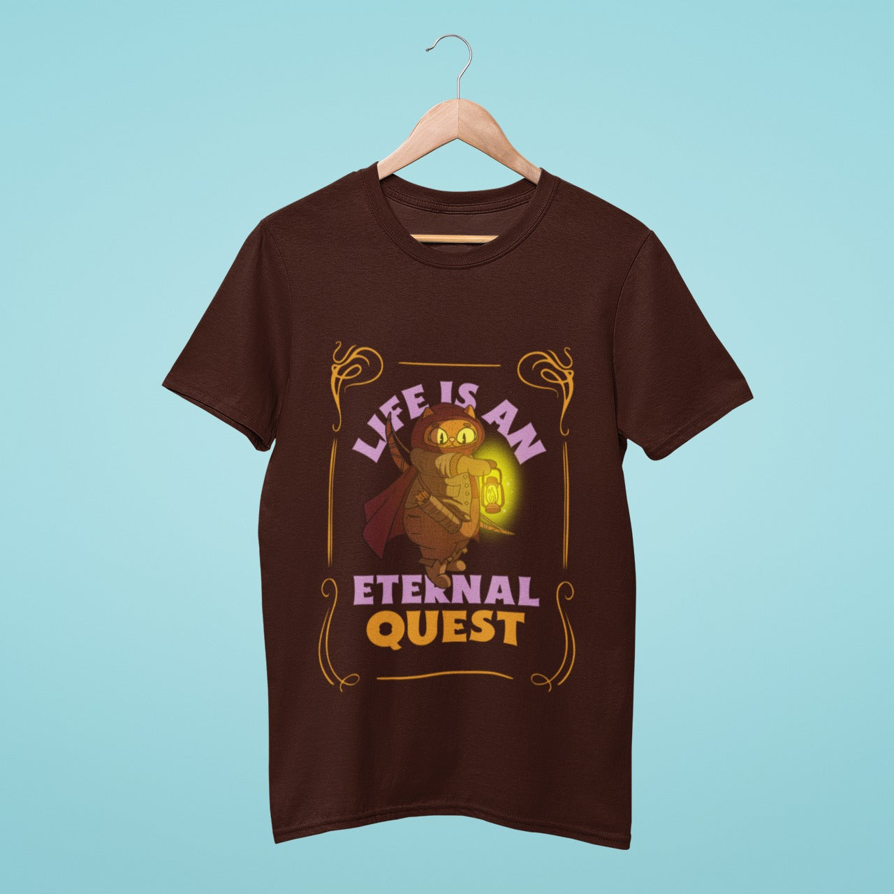 This brown t-shirt is perfect for gamers with a passion for adventure! Featuring an archer cat holding a lamp, along with the inspirational slogan "Life is an eternal quest," this shirt is both stylish and motivational. Wear it as you embark on your own epic quests, whether in the world of gaming or in real life. Get your hands on this t-shirt today and start your journey to greatness!