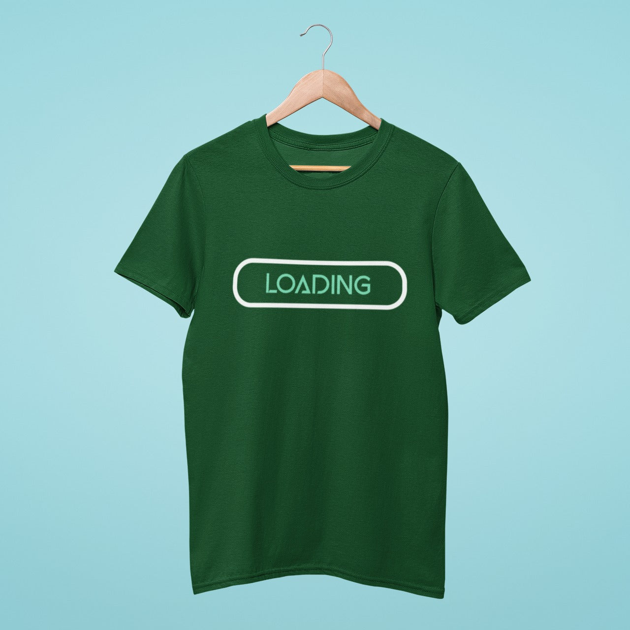 Introducing our trendy green t-shirt with "Loading" written in a cool game-style button. Get ready to level up your style game with this comfy and fashionable t-shirt. Whether you're a gamer or not, this shirt is perfect for any casual occasion. The vibrant green color and unique design will make you stand out from the crowd. Upgrade your wardrobe with this must-have t-shirt today!