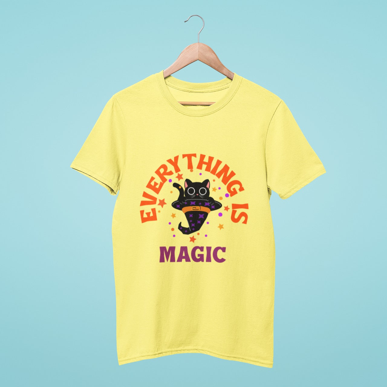 Our yellow "Everything is Magic" t-shirt features a playful black cat in a hat design and soft cotton fabric. The sunny color and whimsical slogan add a touch of joy to your day, while optimized keywords make it easy to find online. Add some magic to your wardrobe today!