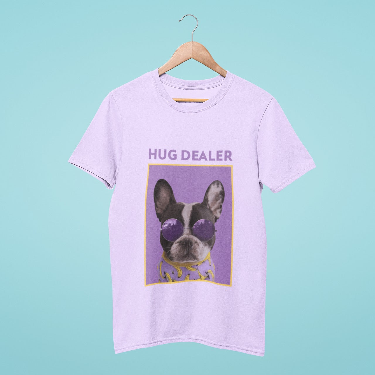 Introducing our "Hug Dealer" lavender t-shirt featuring a cool French bulldog wearing purple sunglasses. This cute and stylish tee is perfect for all dog lovers who want to spread some love and joy. Made from high-quality material, it ensures comfort and durability. Get yours today and become a hug dealer too!