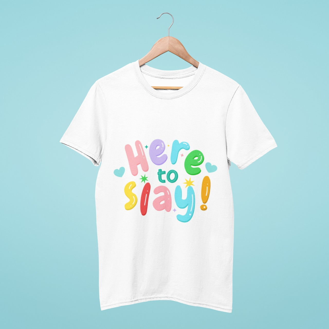 "Here to Slay" in playful colorful letters is proudly displayed on this white t-shirt. Stand out from the crowd and show off your unique personality with this eye-catching and fun design. Perfect for a casual day out or a statement piece at your next pride event.