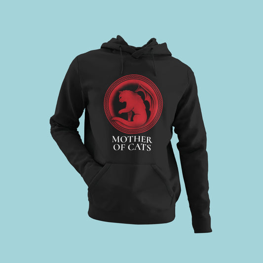 Unleash your inner feline warrior with this black hoodie featuring a red circular graphic inspired by Game of Thrones, but with a cat and the title "Mother of Cats." Comfortable and stylish, this hoodie is perfect for cat lovers and fantasy fans alike. Order now to show off your love for both!