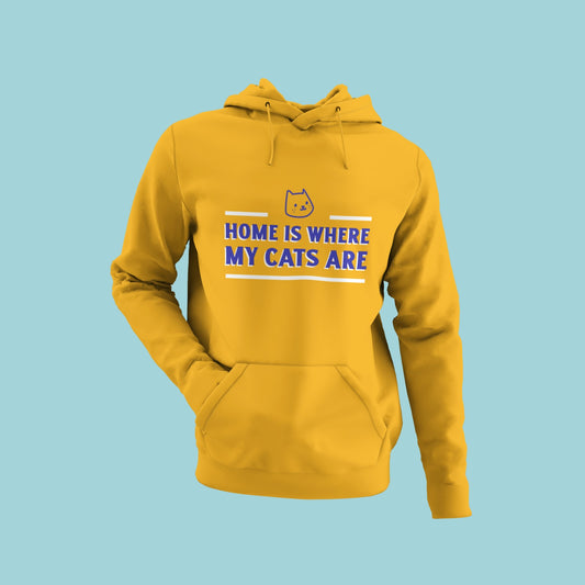 Feel right at home with this yellow hoodie featuring the slogan "Home is where my cats are" and a small cat face above it. The comfortable material and eye-catching design make it perfect for cat lovers and everyday wear. Add some feline charm to your wardrobe and order now to show off your love for your furry friends!