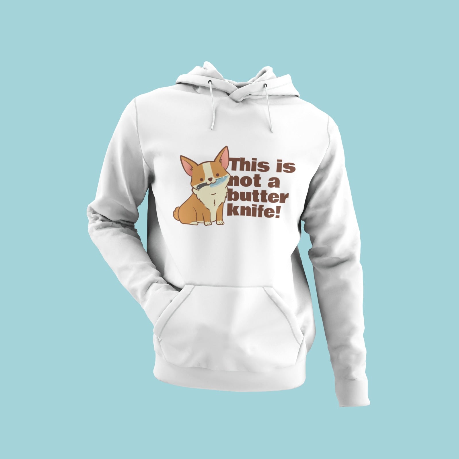 Make a statement with this white hoodie featuring a corgi holding a knife in its mouth and the message "this is not a butter knife!" Perfect for dog lovers who like to add some humor to their style. The eye-catching design is sure to turn heads and spark conversation. Order now and show off your love for corgis and your sense of humor!